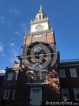 Independence Hall clock tower with shadows across it Editorial Stock Photo