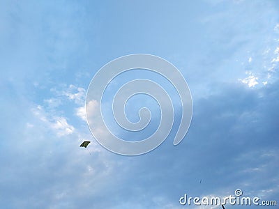 independent kite in pollution free cloudy sky Stock Photo