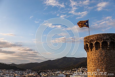 Independentist flag waving on top of medieval tower cloud Stock Photo