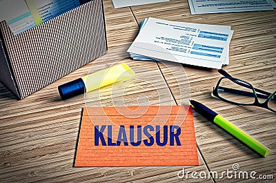 Index cards with legal issues with glasses, pen and bamboo and the german word Klausur in english exam Stock Photo