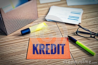 Index cards with legal issues with glasses, pen and bamboo with the german word Kredit in english credit Stock Photo