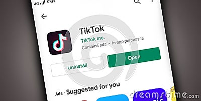TikTok App icon on mobile screen with uninstall and open button at play store Editorial Stock Photo