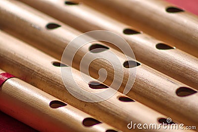 India,Diagonal Close up of the holes of hindu bamboo flute called Bansuri. Stock Photo