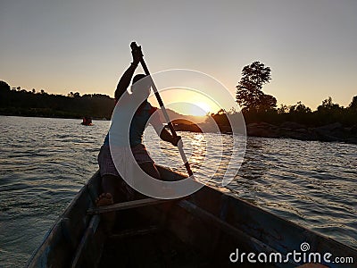 Sunset at Chitrakut with the helmsman silhouetted during the sunset Editorial Stock Photo