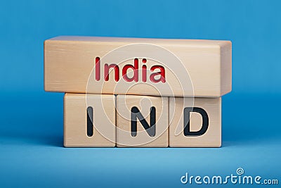 India and IND symbol. Concept words India and IND on wooden blocks. Stock Photo