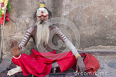 India - Varanasi. A holy man, sadhu looking into the camera. Editorial Stock Photo