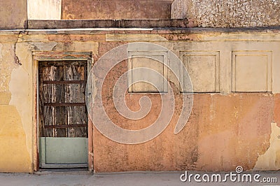 Indian Antiques Architectural Door with classic old wall..of Amber fort. Amber fort its large ramparts Constructed of red sandston Stock Photo