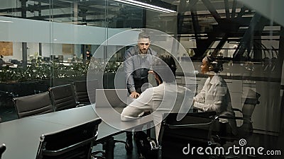 Indian arab male boss leader man coach corporate presentation for diverse businesspeople in office businessman presents Stock Photo