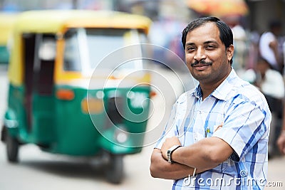 Indian auto rickshaw tut-tuk driver man Stock Photo