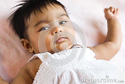 Indian Baby with Wary Expression Stock Photo