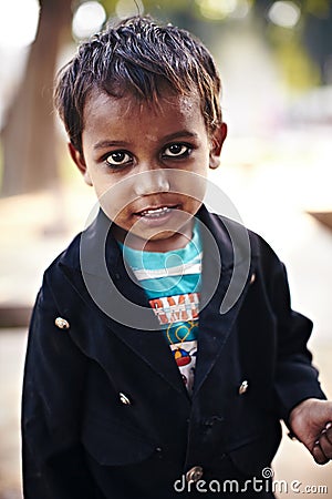 Indian boy market with ash against evil eye nazar Editorial Stock Photo