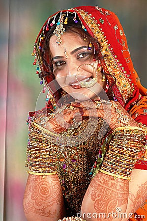 Indian bride in her wedding dress showing bangles Stock Photo