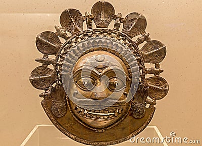 Indian bronze face mask from the tribal folk people of Karnataka, India Editorial Stock Photo
