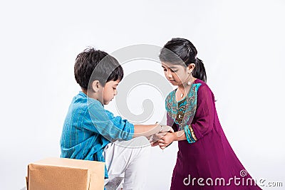 Indian brother and sister celebrating rakshabandhan or rakhi festival Stock Photo