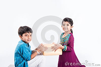 Indian brother and sister celebrating rakshabandhan or rakhi festival Stock Photo