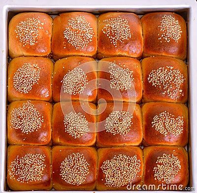 Tray of sesame coated buns Stock Photo