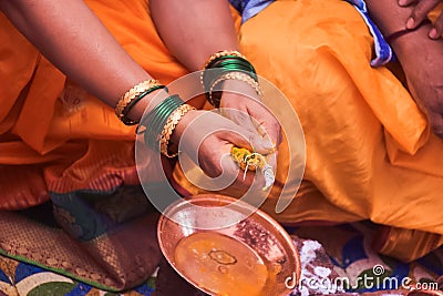 Indian Ceremony With Turmeric Powder Stock Photo