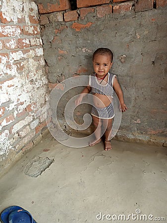 An Indian child playing wear tear cloth Editorial Stock Photo