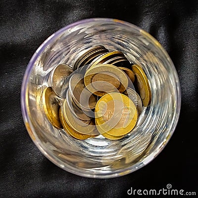 INDIAN COINS IN JAR Stock Photo