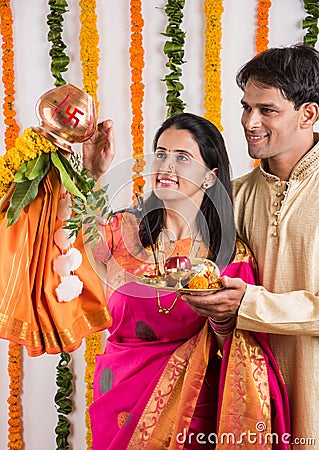 Indian Couple performing or celebrating Gudi Padwa Puja Stock Photo