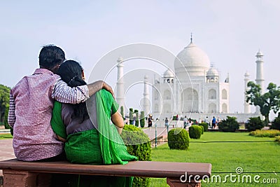 An Indian couple share an intimate moment in front of the monument of love, Taj Mahal Editorial Stock Photo