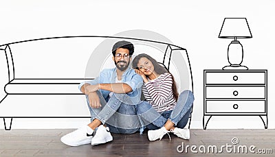 Indian Couple Sitting Near Wall With Drawn Modern Living Room Stock Photo