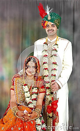 Indian couple in their wedding dress Stock Photo