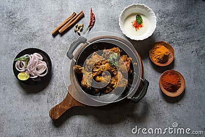 Indian delicacy chicken curry in a black pan Stock Photo