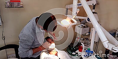an indian dentist doctor checking oral problem into dental clinic in india oct 2019 Editorial Stock Photo
