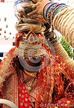 Indian dulhan have taken pooja kalash at head Editorial Stock Photo