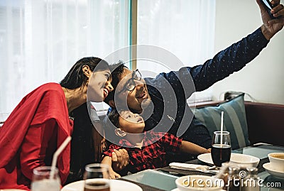 Indian Family out for meal in restaurant Stock Photo