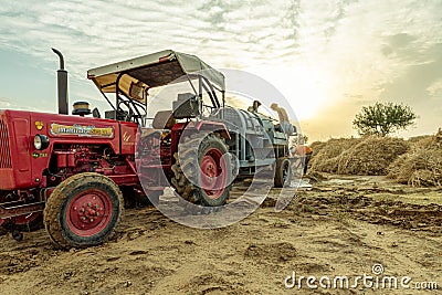 Indian farmer harvesting crop in thrashing machine Editorial Stock Photo