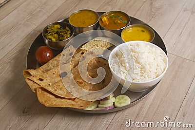 Indian Fasting cuisine Upwas items Thali complere meal for vrat ekadashi.Upawas thali meal with Rajgira puri, paratha,shakarkand Stock Photo