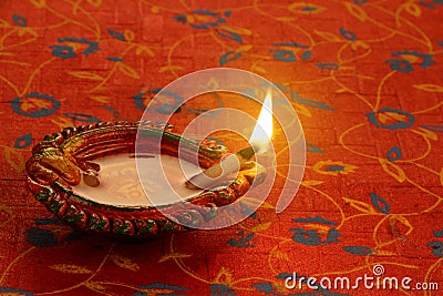 Indian Festival Diwali Diya Lamp Light on Red background Stock Photo