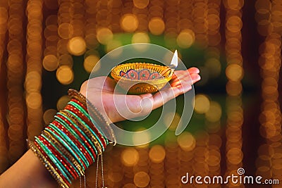 Indian Festival Diwali, lamp in hand Stock Photo