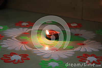Indian festival diwali vibes with glowing diya and rangoli Stock Photo