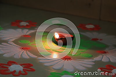 Indian festival diwali vibes with glowing diya and rangoli Stock Photo