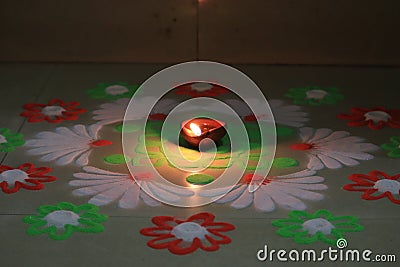 Indian festival diwali vibes with glowing diya and rangoli Stock Photo