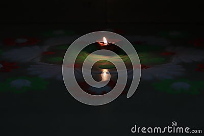 Indian festival diwali vibes with glowing diya and rangoli Stock Photo