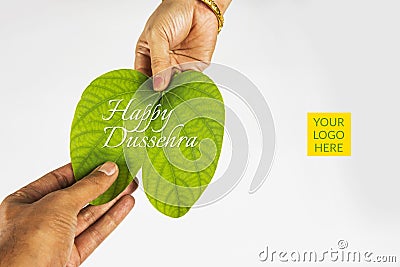 Indian festival dussehra, showing golden leaf with traditional indian sweets pedha in silver bowl on yellow background, greeting c Stock Photo