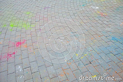 the Indian festival holi, Hindi, the remains of color powder on asphalt Stock Photo