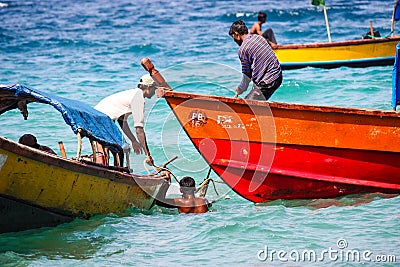 Indian fishermen on their boats in the ocean Editorial Stock Photo