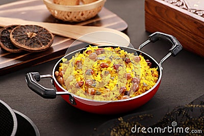 Indian Food Poha with Peanuts in a Wok Stock Photo