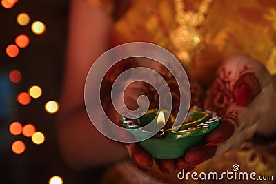 Indian Girl Holding Traditional Oil Lamp Stock Photo