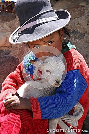 Indian girl with lamb in Peru Editorial Stock Photo