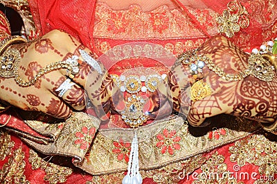 An Indian groom showing her golden belly belt attached above saree Stock Photo