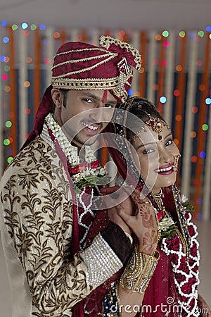 Indian Hindu Bride & Groom a happy smiling couple. Stock Photo