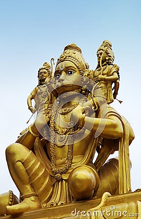 Indian Hindu god Hanuman carrying Rama and Lakshmana on shoulders statue in a temple Stock Photo