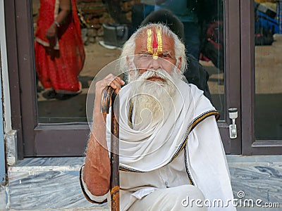 Indian Hindu religion holy old man full white beard on face close up, sandalwood tilak trishul shape paste on forehead Editorial Stock Photo