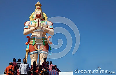 Indian Hindus on stairs of tall Hanuman statue to pray in temple on Mahasivaratri day Editorial Stock Photo